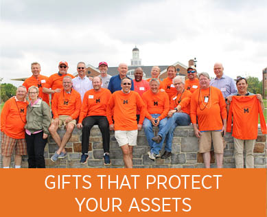 A group of people smiling. Links to Gifts That Protect Your Assets