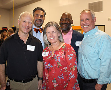 Photo of a group of people smiling. Link to Life Stage Gift Planner Ages 45-65 Situations.