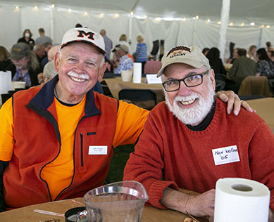Photo of two men smiling for a picture. Link to Life Stage Gift Planner Over Age 65 Situations.